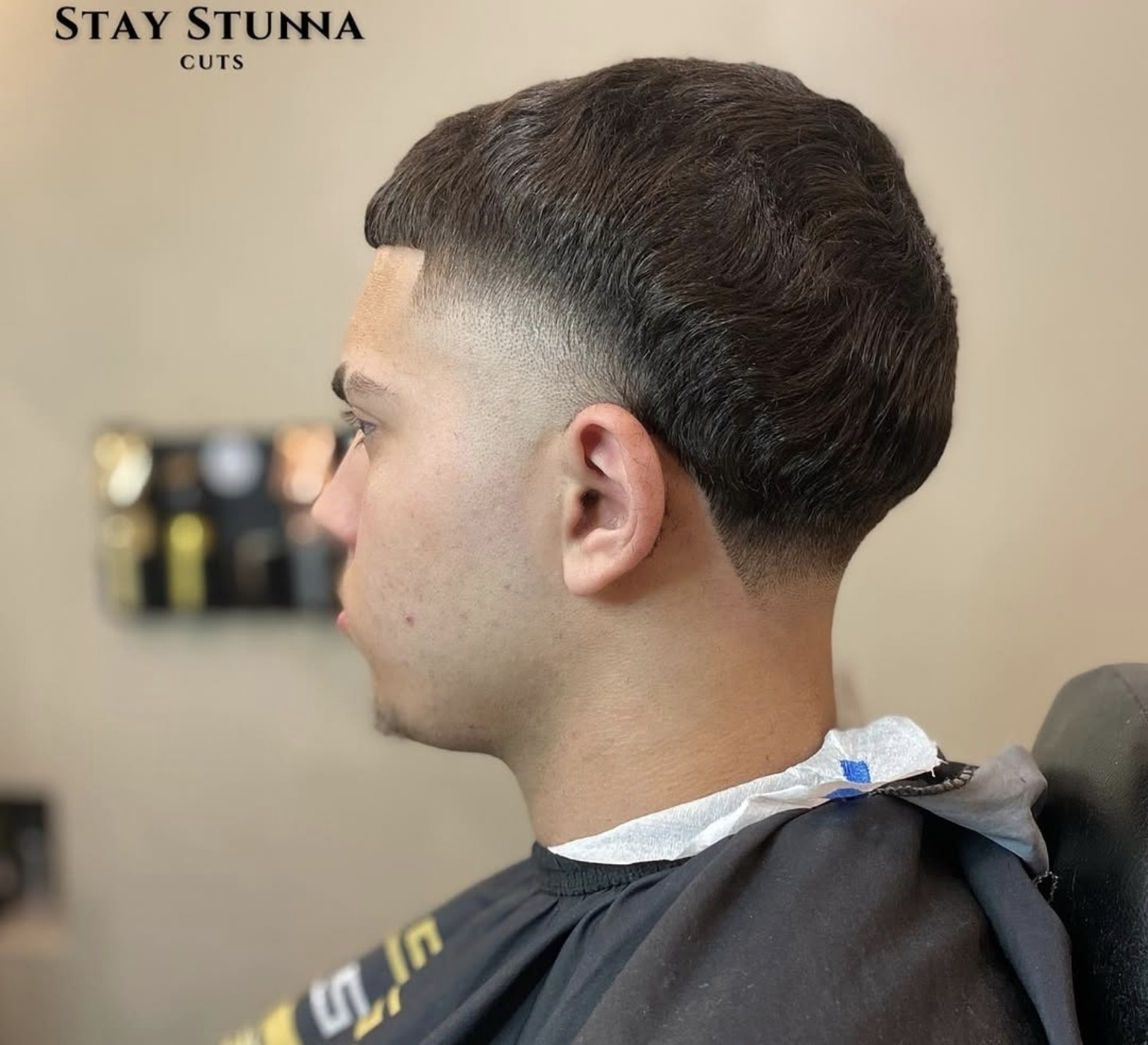 Textured fade met strakke overloop bij Stay Stunna Cuts